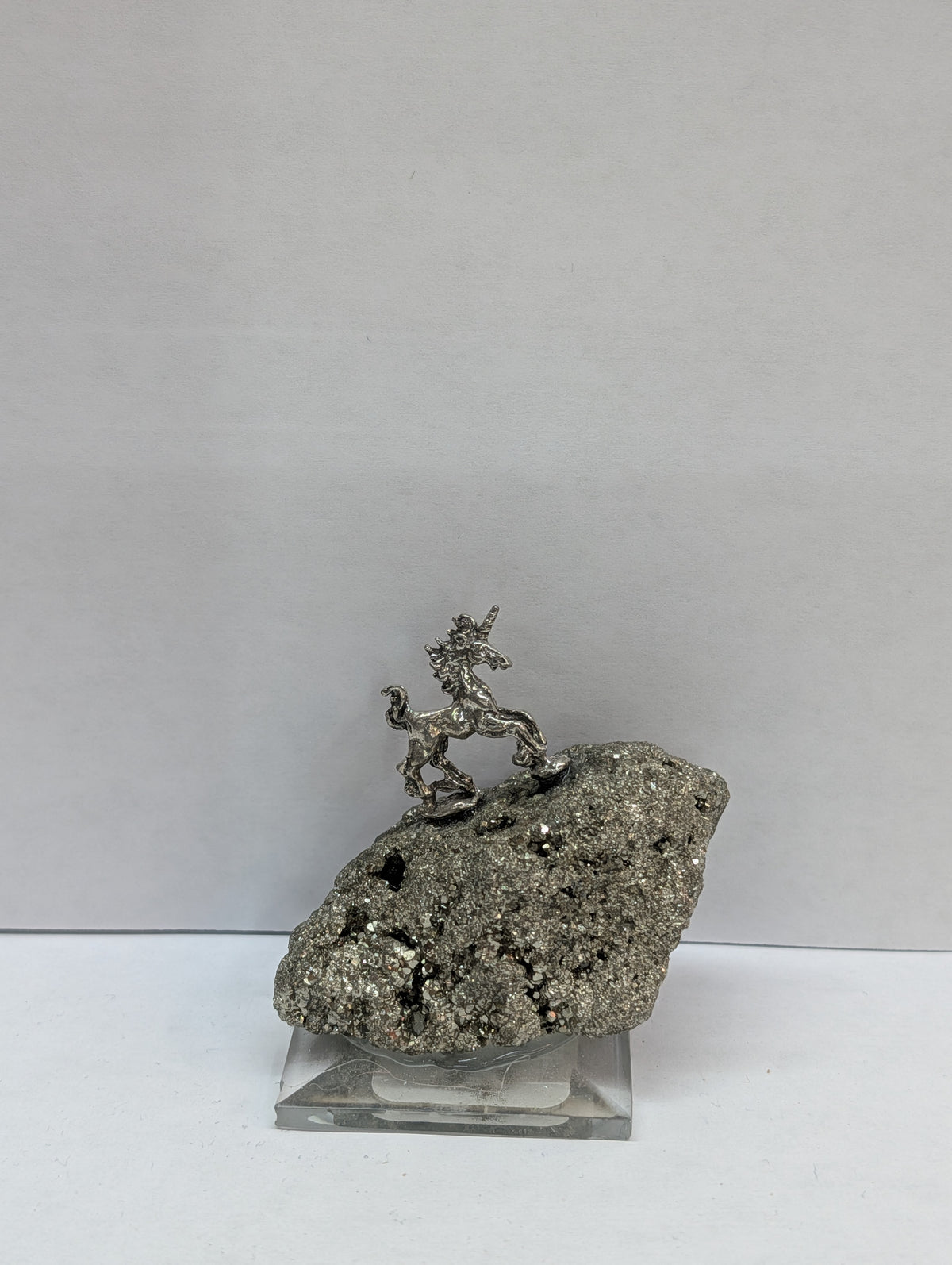 Unicorn on pyrite base