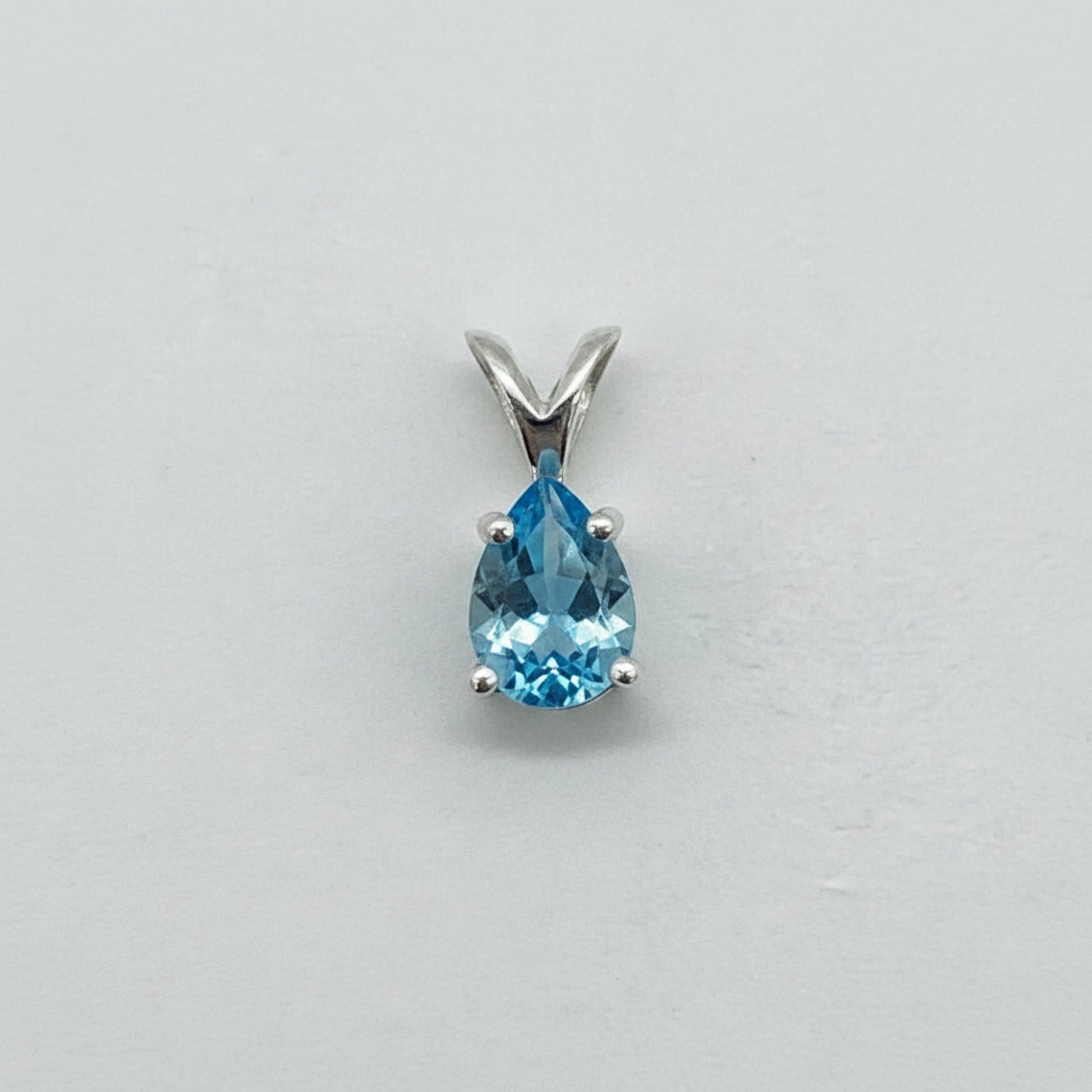Custom gemstone pendant (shown in light blue topaz)